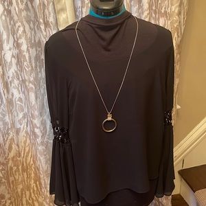 Double Zero sexy party top with rope and ring sleeves.